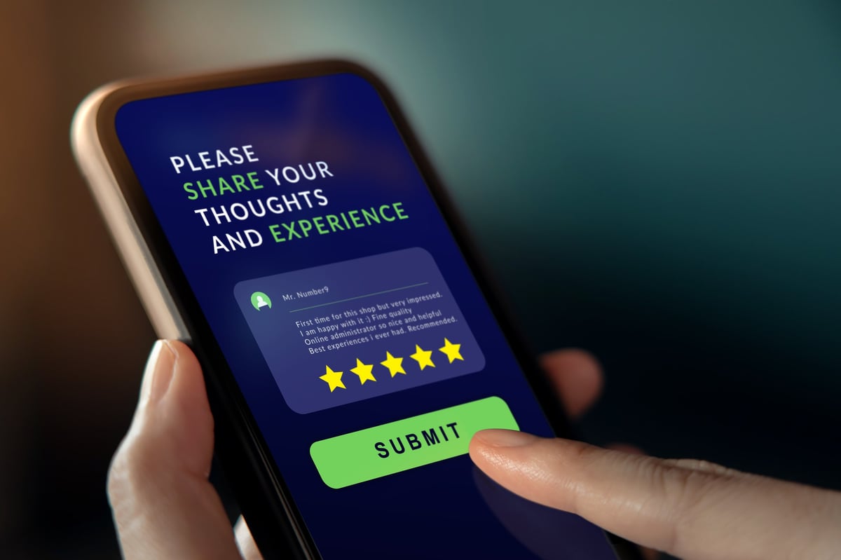 Customer leaving a positive review on a mobile device, emphasizing the impact on local SEO
