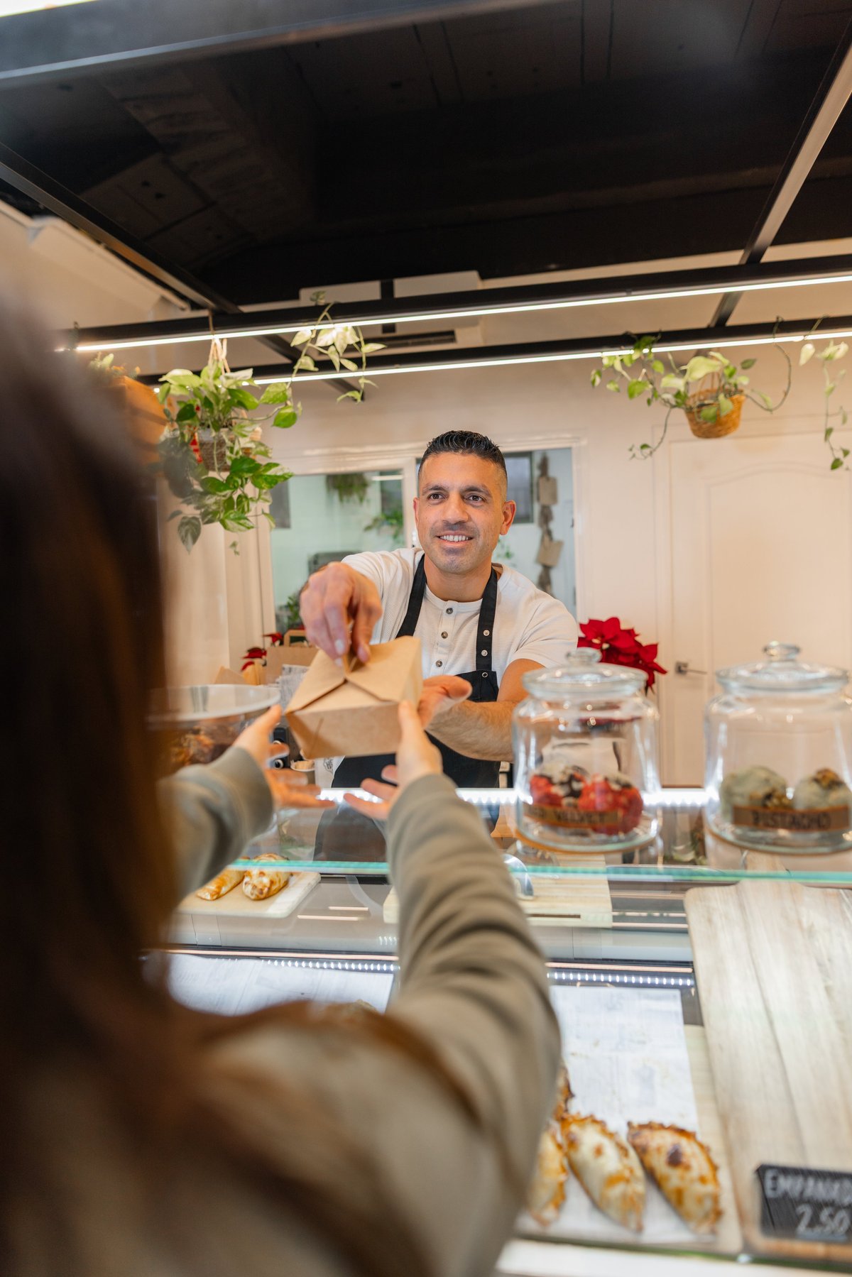 Local business owner engaging with customers in Yakima, WA, highlighting community interaction and growth