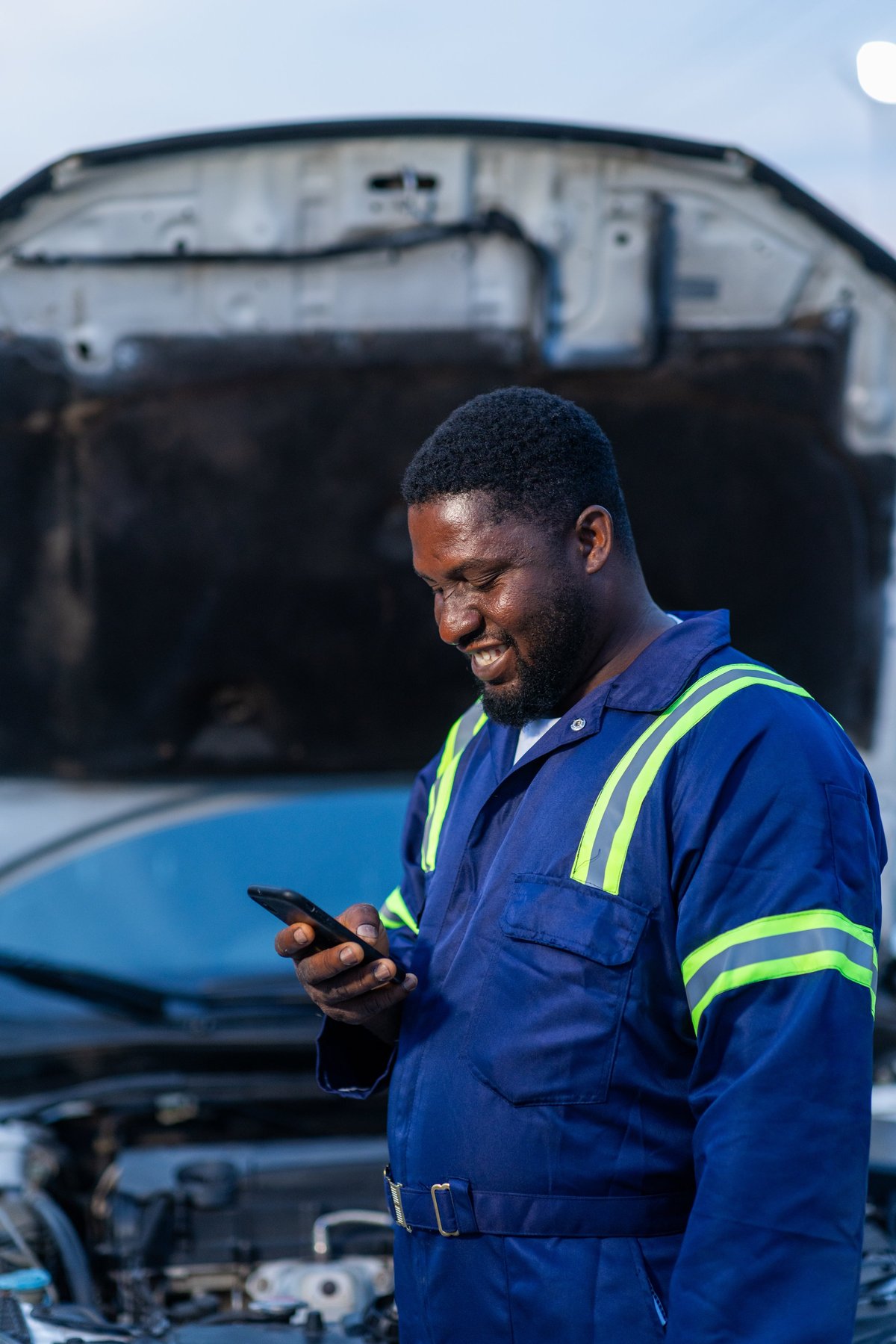 Mobile mechanic small business owner working in his workshop
